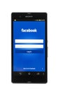 Smartphone Sony Xperia Z and facebook page isolated on white