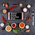 Smartphone, spices, vegetables and fork for meat on a dark background. Hashtags spie smartphone meat, chicken and fish on th Royalty Free Stock Photo