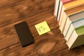 Smartphone and a stack of books on a wooden table. The concept of getting information from books or the Internet