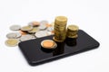 Smartphone with stack of coins , Online to Offline business, create idea of marketing. Image use for retail business, online