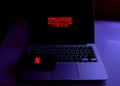 Smartphone with the Stranger Things logo. Stranger Things Royalty Free Stock Photo