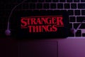 Smartphone with the Stranger Things logo. Stranger Things Royalty Free Stock Photo