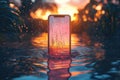 A Smartphone Submerged in Water with a Sunset Reflection on the Screen Royalty Free Stock Photo