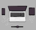 Smartphone, tablet pc and smartwatch connected to laptop computer Royalty Free Stock Photo