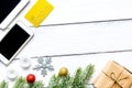 Smartphone, tablet, shopping for new year online wooden table