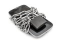 Smartphone tied by chain with padlock on white background. Protected information on smartphone Royalty Free Stock Photo