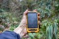 smartphone tracking travel on mountain trails. Royalty Free Stock Photo