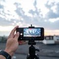 Smartphone on Tripod Capturing a Cloudy Sky Time-Lapse Royalty Free Stock Photo