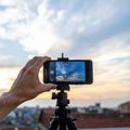 Smartphone on Tripod Capturing Sunset Clouds Royalty Free Stock Photo