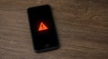 Smartphone under cyber attack with spyware and ransomware threat Royalty Free Stock Photo