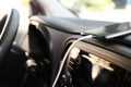 Smartphone with USB charging cable in modern car Royalty Free Stock Photo