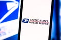 Smartphone with the USPS logo on the screen. Royalty Free Stock Photo