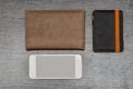 Smartphone, wallet and passport on a black table. Top view