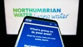 Smartphone with webpage of British company Northumbrian Water Limited on screen in front of business logo. Royalty Free Stock Photo