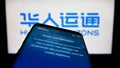 Smartphone with website of Chinese company Human Horizons Technology on screen in front of business logo.