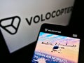 Smartphone with website of German helicopter manufacturer Volocopter GmbH on screen in front of business logo.
