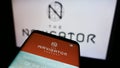 Smartphone with website of Portuguese paper company The Navigator Company S.A. on screen in front of logo.