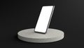 The Smartphone white screen on Round white Stone Pedestal, Mobile phone mockup tilted to the ground. Pedestal can be used for comm