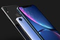 3 iPhone XR blue. silver and Space Grey smart phones on black