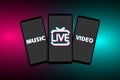 Smartphones with icons of the popular social media TikTok on a modern background. LIVE, VIDEO, MUSIC