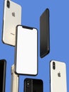 IPhone XS Gold, Silver and Space Grey smartphones, floating in air, white screen Royalty Free Stock Photo