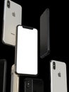 IPhone XS Gold, Silver and Space Grey smartphones, floating in air, white screen