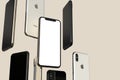 IPhone XS Gold, Silver and Space Grey smartphones, floating in air, white screen