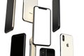 IPhone XS Gold, Silver and Space Grey smartphones, floating in air, white screen Royalty Free Stock Photo