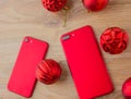 Two red phones and Christmas balls. Royalty Free Stock Photo