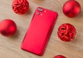 Two red phones and Christmas balls. Royalty Free Stock Photo