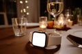 Smartwatch Mockup on Table at Elegant Dinner Setting Royalty Free Stock Photo