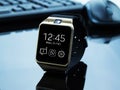 Smartwatch near computer pc keyboard and mouse Royalty Free Stock Photo