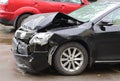 Smashed black car after an accident Royalty Free Stock Photo