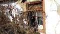 Smashed glass Window with old wooden frame on grunge wall damaged house Royalty Free Stock Photo