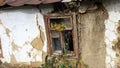 Smashed glass Window with old wooden frame on grunge wall damaged house Royalty Free Stock Photo