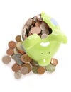 Smashed piggy bank with British currency coins Royalty Free Stock Photo