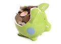Smashed piggy bank with British currency coins Royalty Free Stock Photo