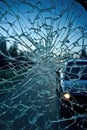 smashed windshield with cracks and shattered glass