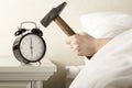 Smashing Alarm Clock with Hammer Royalty Free Stock Photo