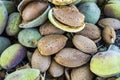 Smashing almond with stone, pouring almonds, eating almonds is good for health, natural almonds, dry almond seeds