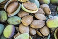 Smashing almond with stone, pouring almonds, eating almonds is good for health, natural almonds, dry almond seeds