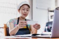 SME chef woman reding greeting card wearing apron and hat. Royalty Free Stock Photo