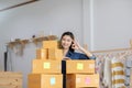 SME entrepreneur of Young Asian women working with laptop for Online shopping at home,Cheerful and Happy with box for packaging in Royalty Free Stock Photo