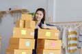 SME entrepreneur of Young Asian women working with laptop for Online shopping at home,Cheerful and Happy with box for packaging in Royalty Free Stock Photo