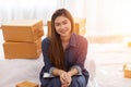 SME entrepreneur of Young Asian women working with laptop for Online shopping at home,Cheerful and Happy with box for packaging in Royalty Free Stock Photo