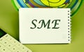 SME, Small and medium-sized enterprises. Business model. KEY TO SUCCESS concept. SME a note written on a blank sheet of a notebook Royalty Free Stock Photo