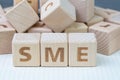 SME, small and medium-sized enterprises concept, cube wooden block with alphabet combine the word SME, entrepreneur business