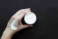 Smear cream on woman hand. Lotion for face or body Royalty Free Stock Photo