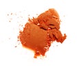Smear of crushed orange eyeshadow as sample of cosmetic product Royalty Free Stock Photo