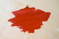 Smear of red paint on wooden background Royalty Free Stock Photo